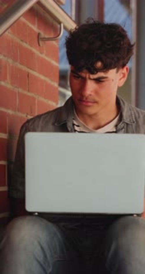 Student, education and teen with laptop, outdoor and exam preparation with info and academic growth