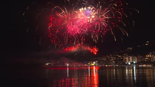 Fireworks with Colorful Lights Over Sea