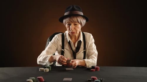 Elderly Woman Smiling While Dealing Poker Cards