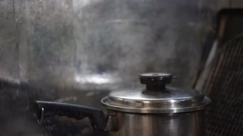 Steaming Pot on a Gas Stove in Kitchen