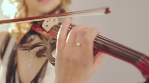 Woman Playing Electric Violin Close Up