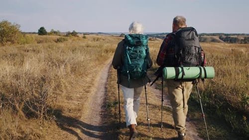 Senior Couple Hiking in the Countryside Together