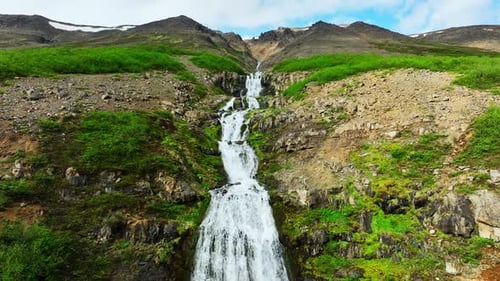 Many Waterfalls Surrounded By Green Bushes and Moss Mountain River Flows Down From Hill River in