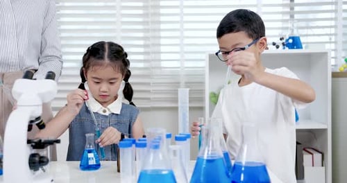 Children Enjoying Science Experiment in School Lab