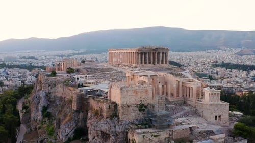 Acropolis Of Athens With Historic Temples And Buildings At Sunrise Above City of Athens In Greece. -