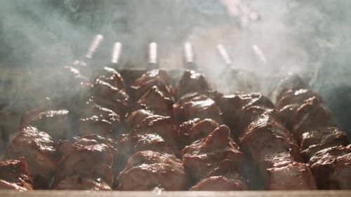 Delicious Meat Cooking Over Hot Grill with Smoke