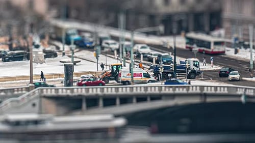 Busy traffic on the crossroad in front of the Dancing House on the Jiraskove nam. in Prague. Constru