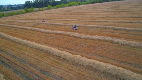Bike extreme countryside traveling aerial view. Motocross meadow riding.