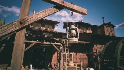 Vintage Lantern Hanging in a Rustic Western Town During Bright Daylight