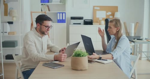 Interior Designers Working At Desk In Office Planning Interior Design