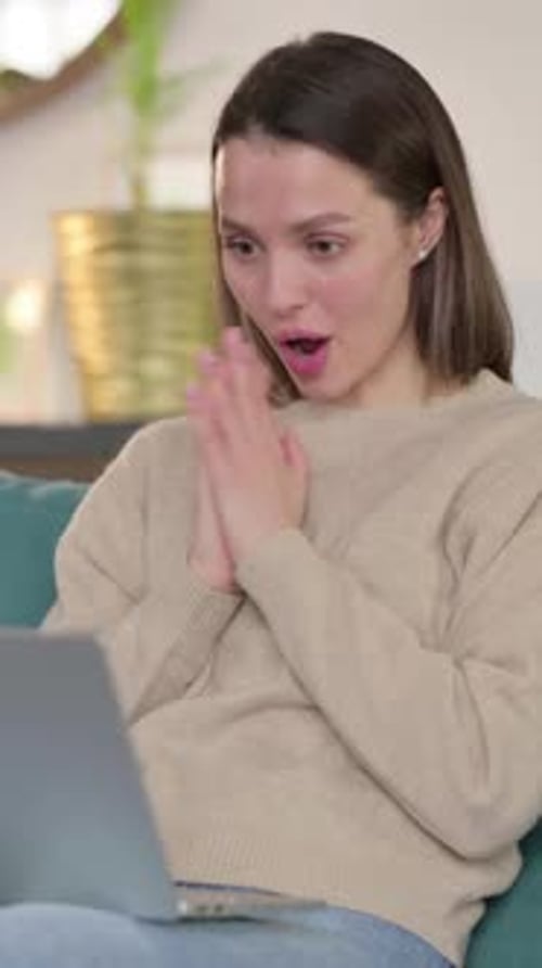 Woman Video Calling Using Laptop in Home