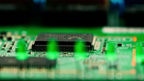 Green printed circuit motherboard components microchips CPU processor transistors semiconductors
