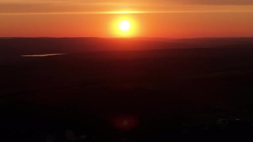 Scenic view of a distant city at sunset