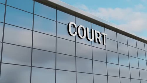 Airplane Passing Over a Court Building