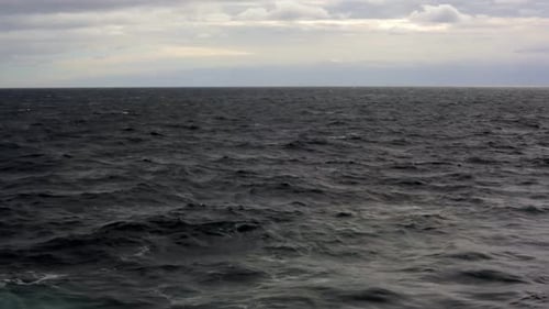 View from ship of dark, rough, cloudy Sea between Prince Edward Island and La Baie, Saguenay.