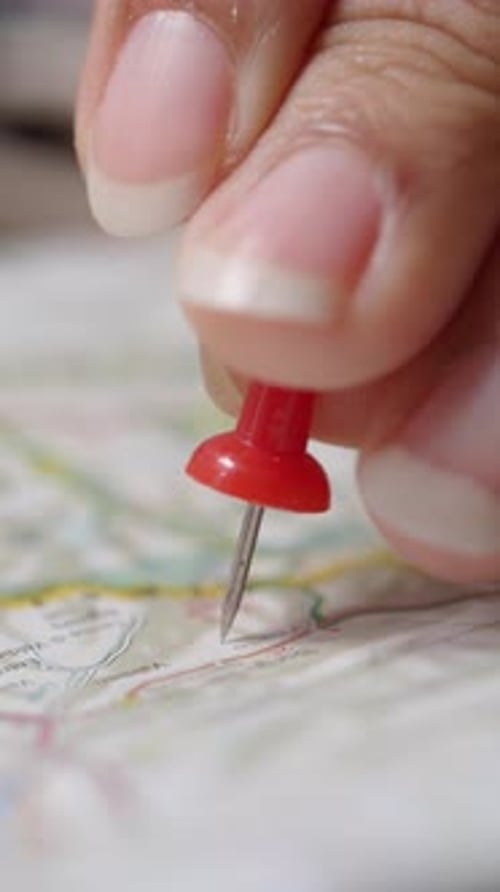 Close Up of Red Pin Placed on Map