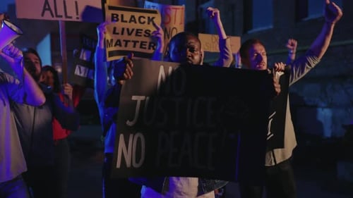 Group of Multiethnic Protests Striking for Human Rights at Night Demonstration Vigorous Crowd of