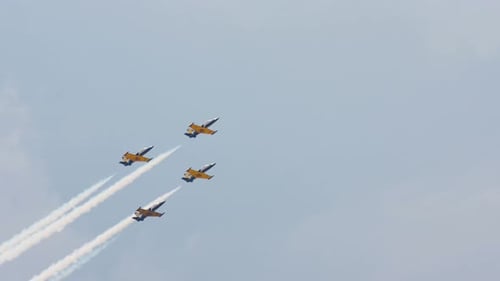 Military jets Aero L-39 Albatros flying fast sky contrail airshow. L39 air show.