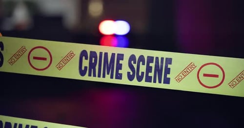 Crime Scene Tape at Night with Police Lights