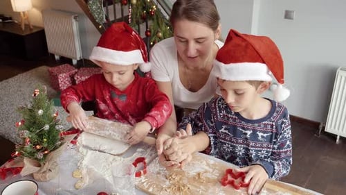Mother and Children Make Christmas Cookies Together