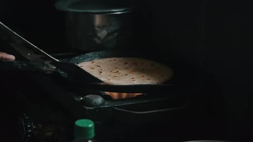 Flatbread Cooking in a Pan on a Gas Stovetop