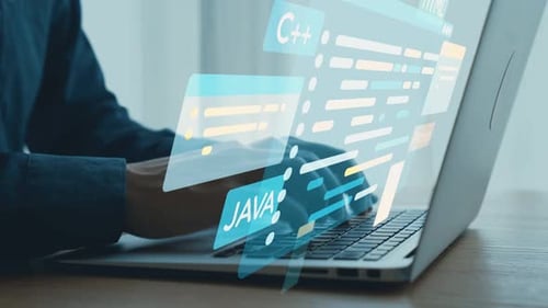 Close-up of Hands Typing on Laptop Keyboard with Programming Code Elements and Digital Symbols Repre