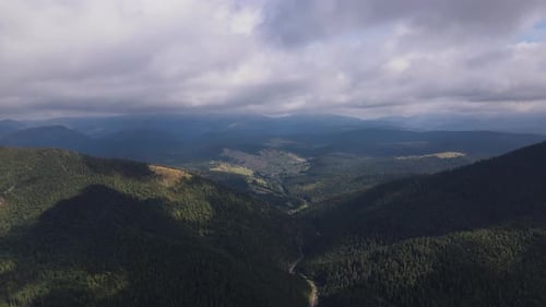 Aerial Landscape View of the Carpathian Mountains Drone Flies Forwards Through the Low Clouds