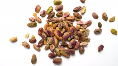 Fresh Healthy Pistachio Nuts Rotating View On White Table Background