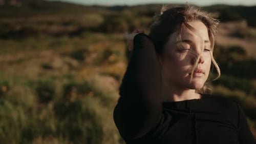 Woman Posing Outdoors in Golden Sunlight
