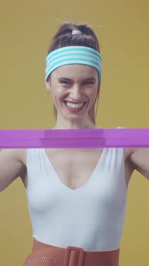 Woman Exercising with Resistance Band for Fitness