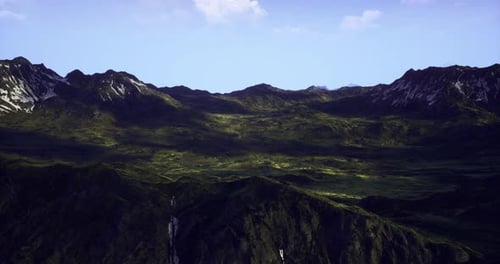 Striking Mountain Landscape with Lush Greenery Under a Clear Blue Sky