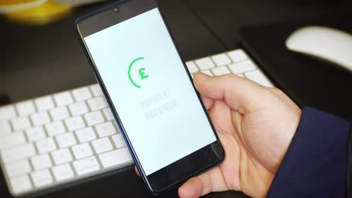 A payment received notification is received on a payment app on a cell phone. The mobile application