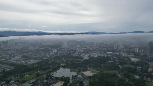 Kuala Lumpur city awakening in morning haze.