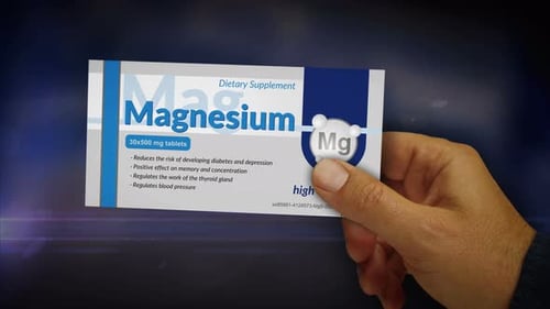 Magnesium tablets pack in hand abstract concept
