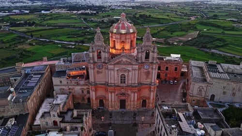 Aerial view of the historic church in Mdina, Malta surrounded by greenery