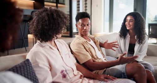 Young Adults Talking on Couch in Modern Home