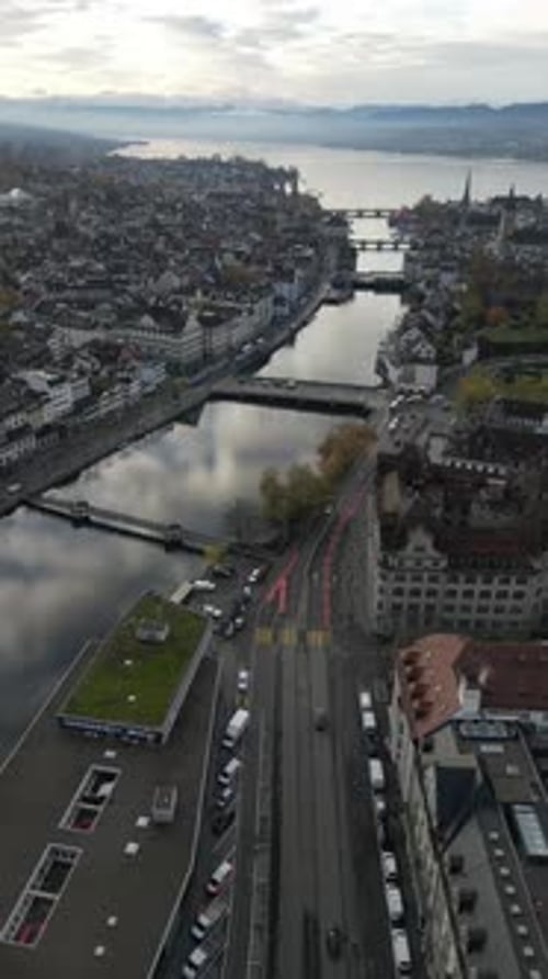 Aerial drone footage of the Zurich old town along the Limmat river , Switzerland