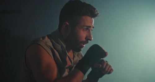 Boxer Training in Low Light Gym