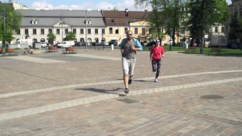 Active Couple Jogging In The City, Super Slow Motion