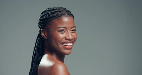 Skincare, laugh and face of black woman in studio with health, beauty and facial glow