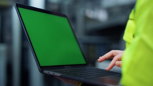 Factory Woman Typing Laptop Greenscreen