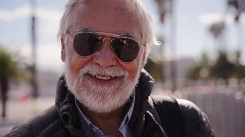 Smiling Senior Man with Sunglasses Outdoors
