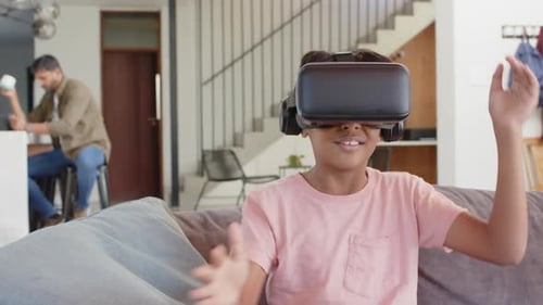 Smiling Boy Enjoys Virtual Reality Gaming at Home