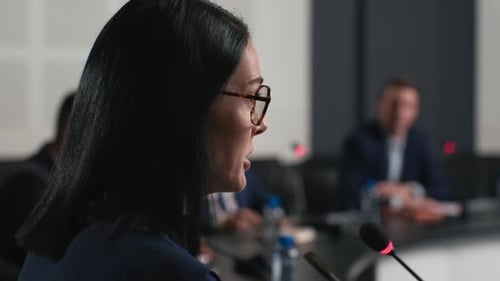 Political speaker gives speech at modern business forum conference hall