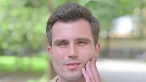 Close up of Young Man Face with Toothache, Outdoor