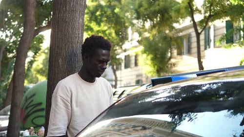 Young Adult Man Standing in Urban Environment