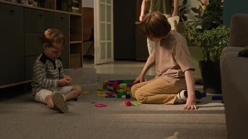 Children Playing with Colorful Blocks at Home