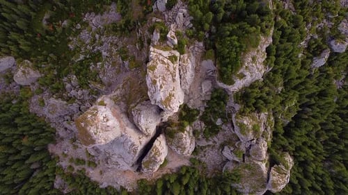 Aerial shot of mountains. Mountains, peaks, cliffs, rocks, ridges, landscape, green grass, sky, clou