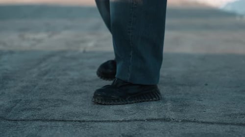 Footsteps on Rooftop Solitary Figure Steps Softly Across Weathered Rooftop Resilient Individual