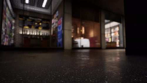 Une devanture de magasin floue la nuit